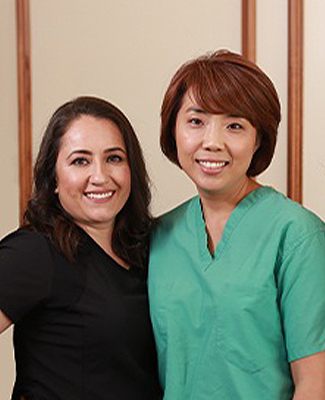 Dr. Kim and two dental team members